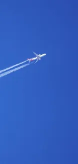Jet airplane soaring high in blue sky background.