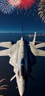 Jet flying beneath fireworks in a dark night sky over the ocean.