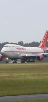 Jet airplane landing on runway at dusk, showcasing aviation power.