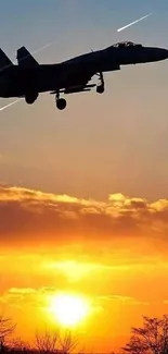 Jet silhouette flying over a vibrant sunset sky.