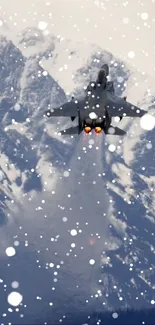 Fighter jet ascending over snowy mountains with exhaust plume.