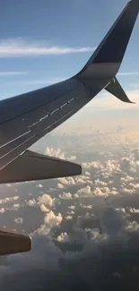 Jet wing above clouds with clear blue skies.