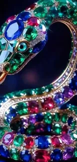 Jewel-encrusted serpent with vibrant gemstones in dark blue setting.