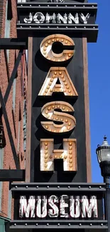 Johnny Cash Museum sign against a clear blue sky.