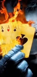 Joker holding flaming playing cards in darkness.