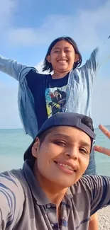 Friends smiling on a sunny beach, exuding joy and seaside vibes.