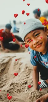 Smiling child on beach with floating hearts, enjoying the sand.