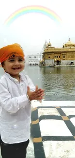 Joyful child at Golden Temple with a rainbow.