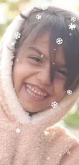 Smiling child wearing a fuzzy hoodie in a sunny park.