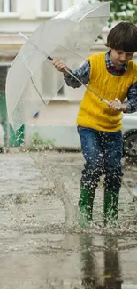 Child in yellow vest splashing in rain with umbrella.