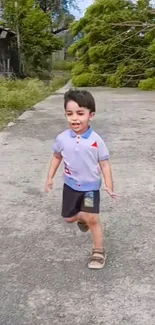 Young child joyfully running outdoors on a sunny day.