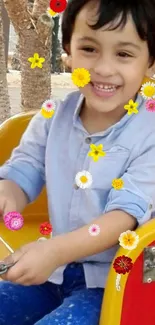 Smiling child in a playground with colorful flower graphics.