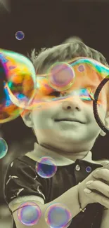 Happy child playing with colorful soap bubbles.