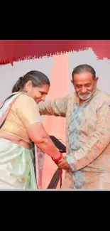 Joyful couple in traditional dance attire.