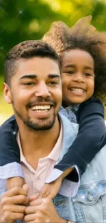 Father carrying daughter on shoulders outdoors in a joyful moment.