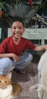 Child smiling with pets in an outdoor setting.