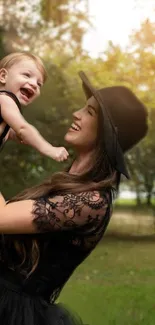 Mother joyfully holding child in nature, warm tones.