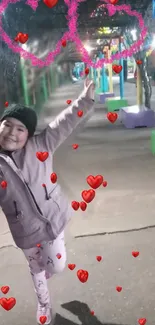 Smiling girl with hearts during night walk.