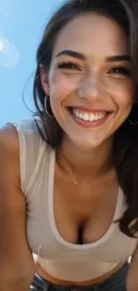 Smiling woman in the sunlit outdoors with a blue sky background