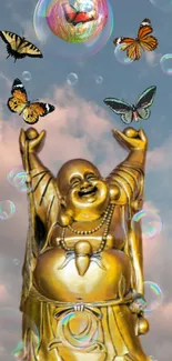 Golden Buddha statue with butterflies and bubbles against a cloudy sky background.