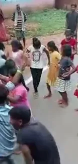 Children engage in joyful street dance celebration.