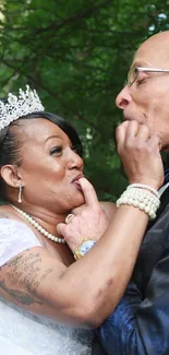 Joyful bride and groom in lush green setting.