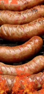 Juicy sausages grilling over open flame with a delicious brown finish.