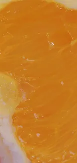 Close-up of juicy orange fruit displaying vibrant texture.