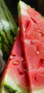 Close-up of juicy watermelon slices with seeds and vibrant colors.