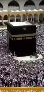 Aerial view of the Kaaba during pilgrimage in Mecca, surrounded by worshippers.