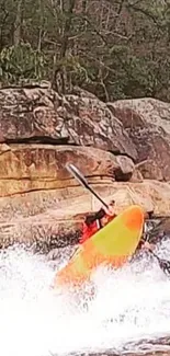 Kayaker navigating whitewater rapids with orange kayak.