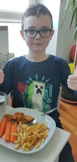 A cheerful child giving a thumbs-up while eating at home.