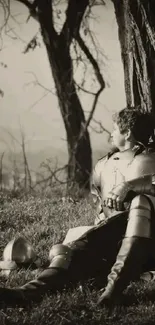 Medieval knight resting under a tree in sepia-toned landscape.