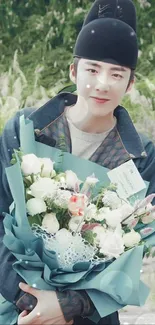 Person in Korean attire with bouquet against a green backdrop.