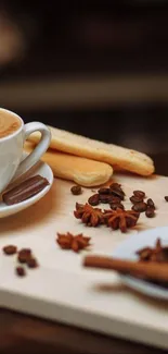 Coffee cup with latte art and biscuits on a wooden board.