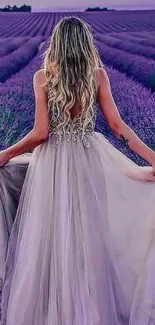 Blonde woman in flowing dress in lavender field backdrop.