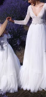 Elegant scene with lavender fields and white dresses.