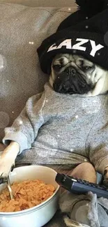 Cozy pug in sweater and hat with bowl of cereal on couch.