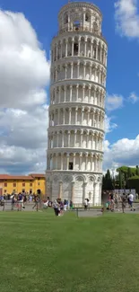 Iconic Leaning Tower of Pisa under a blue sky.