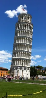 Leaning Tower of Pisa under a bright blue sky.