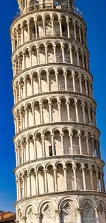 Leaning Tower of Pisa against blue sky.