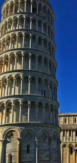 Leaning Tower of Pisa against blue sky.