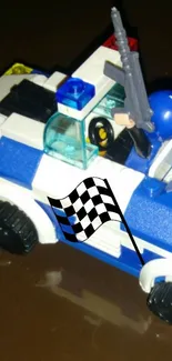 Lego police car with checkered flag design.