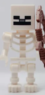 LEGO skeleton holding a brown bow.