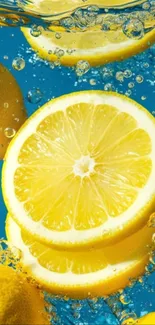 Sliced lemons in water with bubbles on blue background wallpaper.