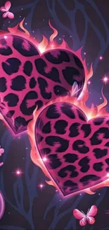 Leopard print hearts surrounded by flames on a dark background.