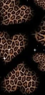 Leopard print hearts on a black background wallpaper.