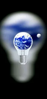 Earth inside a light bulb on black background.