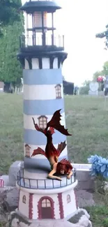 Lighthouse with dragon statue in cemetery setting.