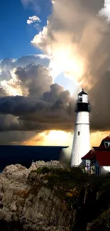 Lighthouse with dramatic sunset and ocean view.